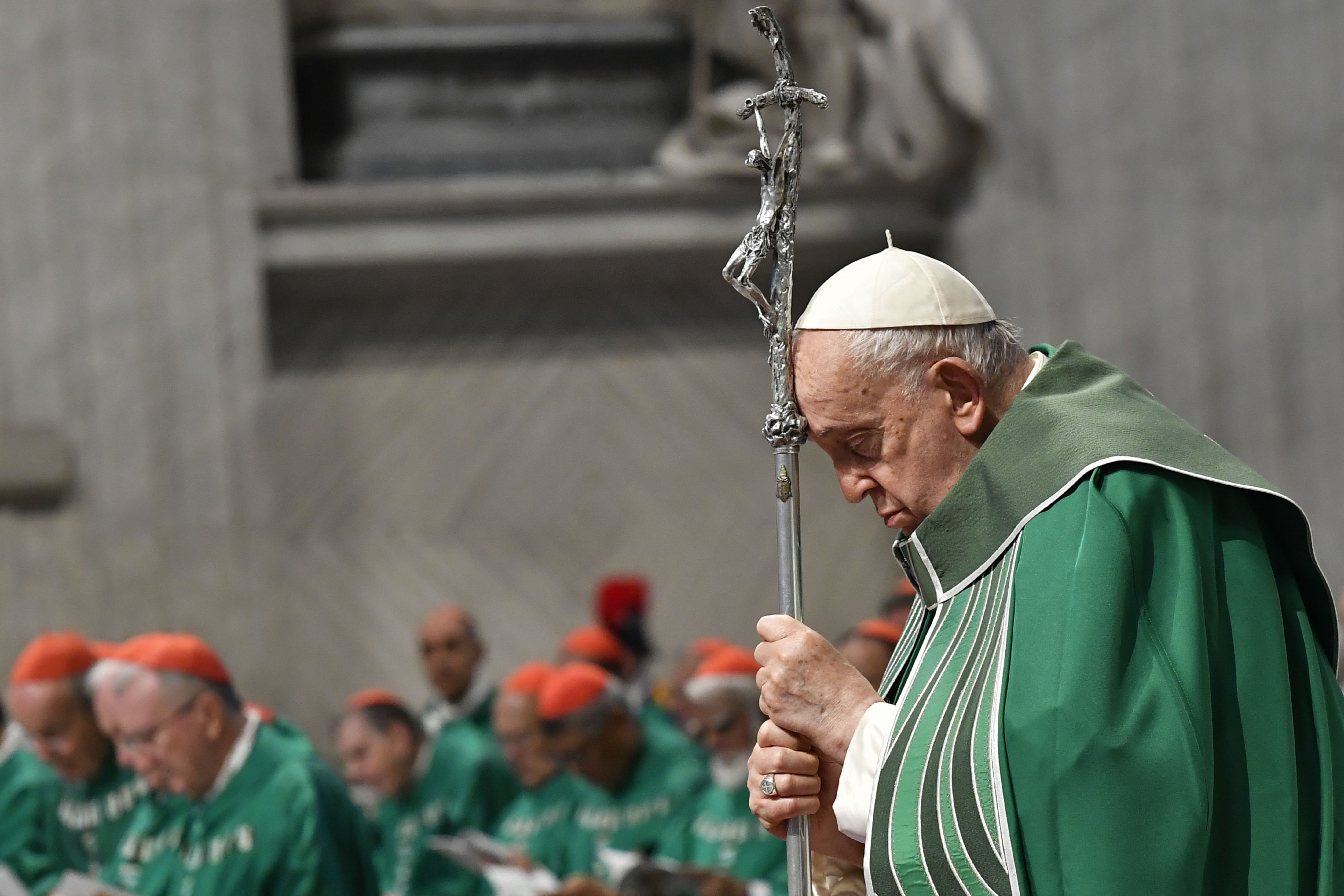 Pope Francis prays while holding a crosier during Mass in St. Peter's Basilica at the Vatican Oct. 29, 2023, marking the conclusion of the first session of the Synod of Bishops on synodality. (CNS photo/Vatican Media)