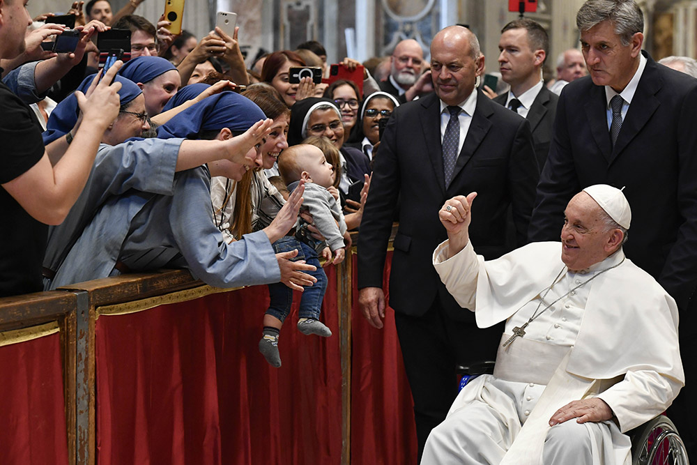 Pope Francis greets the faithful after Mass in St. Peter's Basilica at the Vatican Oct. 29, marking the conclusion of the first session of the Synod of Bishops on synodality. (CNS/Vatican Media)