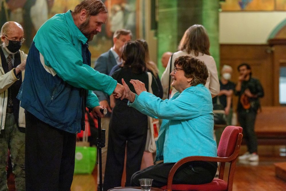 Sr. Helen Prejean greets an attendee after a Sept. 22 public event on the opera "Dead Man Walking."