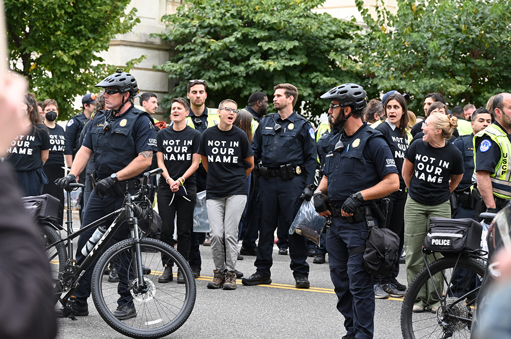 Capitol Police arrest demonstrators urging the U.S. government to advocate for a cease-fire in Gaza outside the Cannon House Office Building on Capitol Hill on Oct 18. (RNS/Jack Jenkins)
