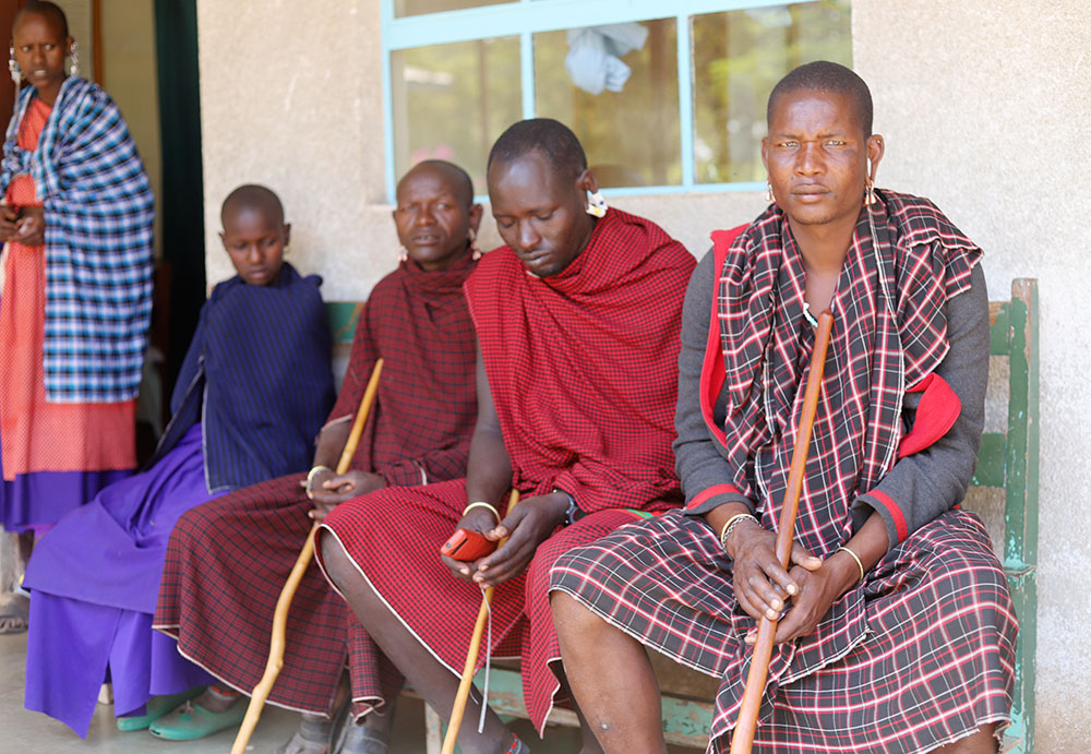 A group of Maasai people wait to be attended by nurses who are mostly religious at Endulen Hospital, located in the Ngorongoro conservation area in northern Tanzania. Religious leaders, including sisters, have remained in Ngorongoro to serve residents seeking medical care, water, food and education for their children despite the government cutting off vital services in the area. (GSR photo/Doreen Ajiambo)