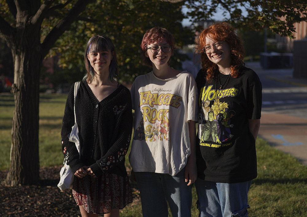 A group of friends and freshmen at the University of Missouri, Sylvia Debruzzi, left, Sarah Woods, center, and Emma Komoroski, right, who all identify as formerly religious, but currently unaffiliated, laugh after having their photo taken while walking through campus Sept. 8 in Columbia, Missouri. (AP/Jessie Wardarski)