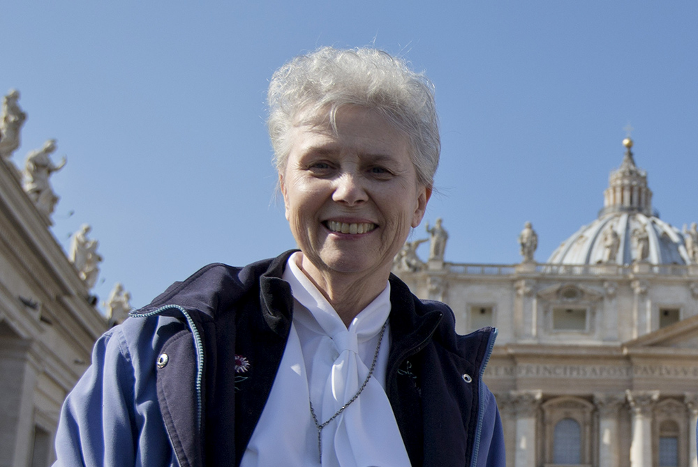 Loretto Sr. Jeannine Gramick poses for a photo in front of St. Peter's Basilica at the Vatican, after she and New Ways Ministry pilgrims attended Pope Francis' weekly general audience Feb. 18, 2015. (AP/Andrew Medichini)