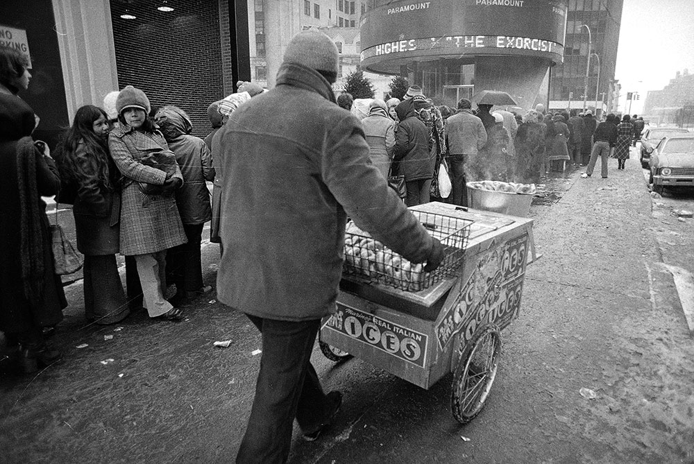 Despite subfreezing temperatures and rain, a crowd waits in line outside the Paramount Theater in New York City Feb. 4, 1974, for a showing of "The Exorcist." (AP Photo/Ron Frehm)