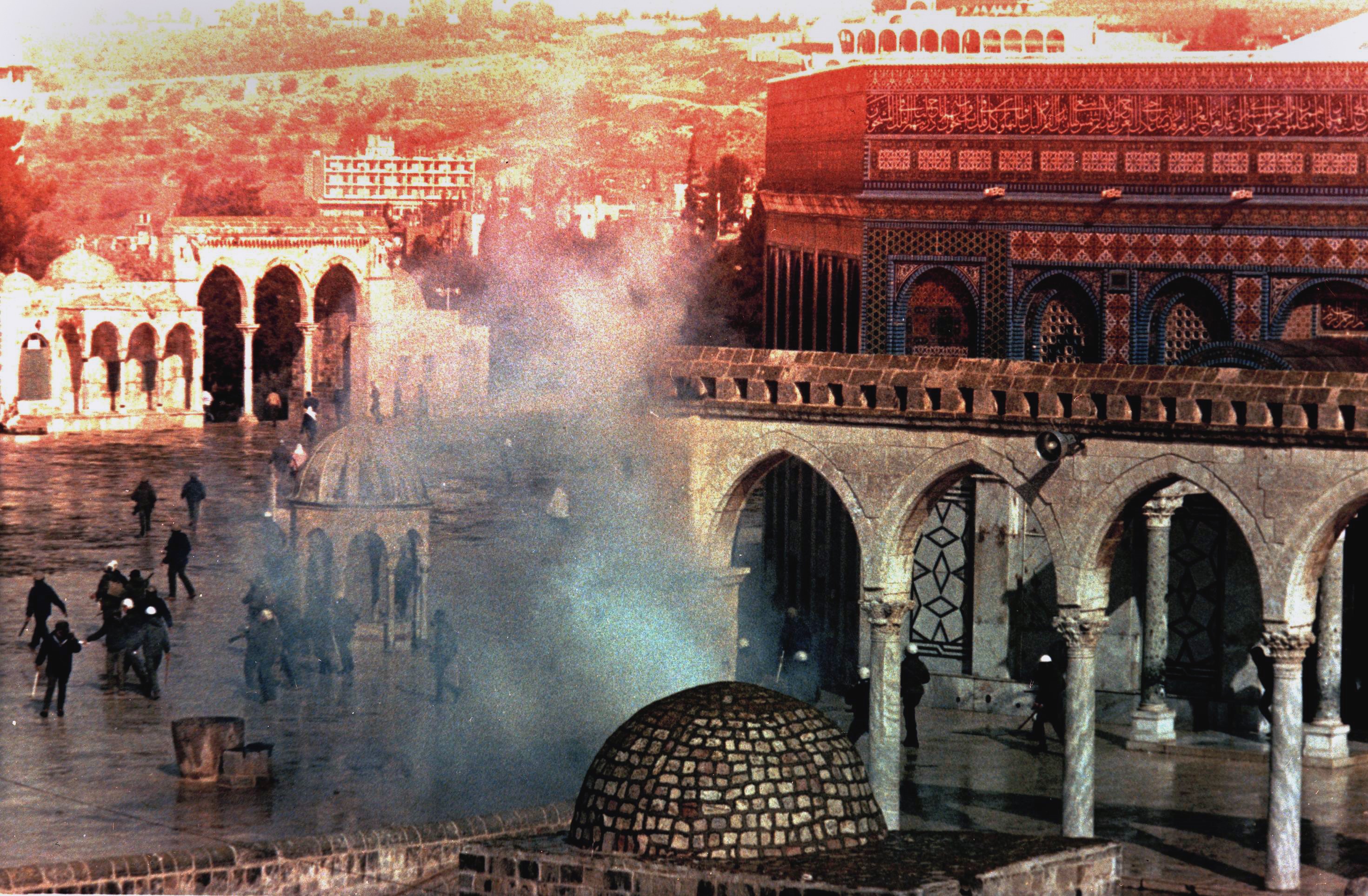 A cloud of tear gas rises from the square in front of the Dome of the Rock mosque during clashes between Palestinians and Israeli troops, which started after the Friday noon prayers on the Temple Mount in the old city of Jerusalem Jan. 15, 1988. (AP/Anat Givon)