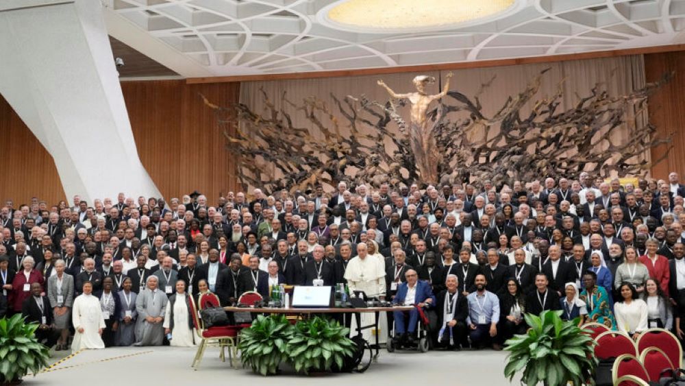 Pope Francis poses for a picture with participants of the Synod of Bishops' 16th General Assembly in the Paul VI Hall at the Vatican, Oct. 23. (AP/Gregorio Borgia)
