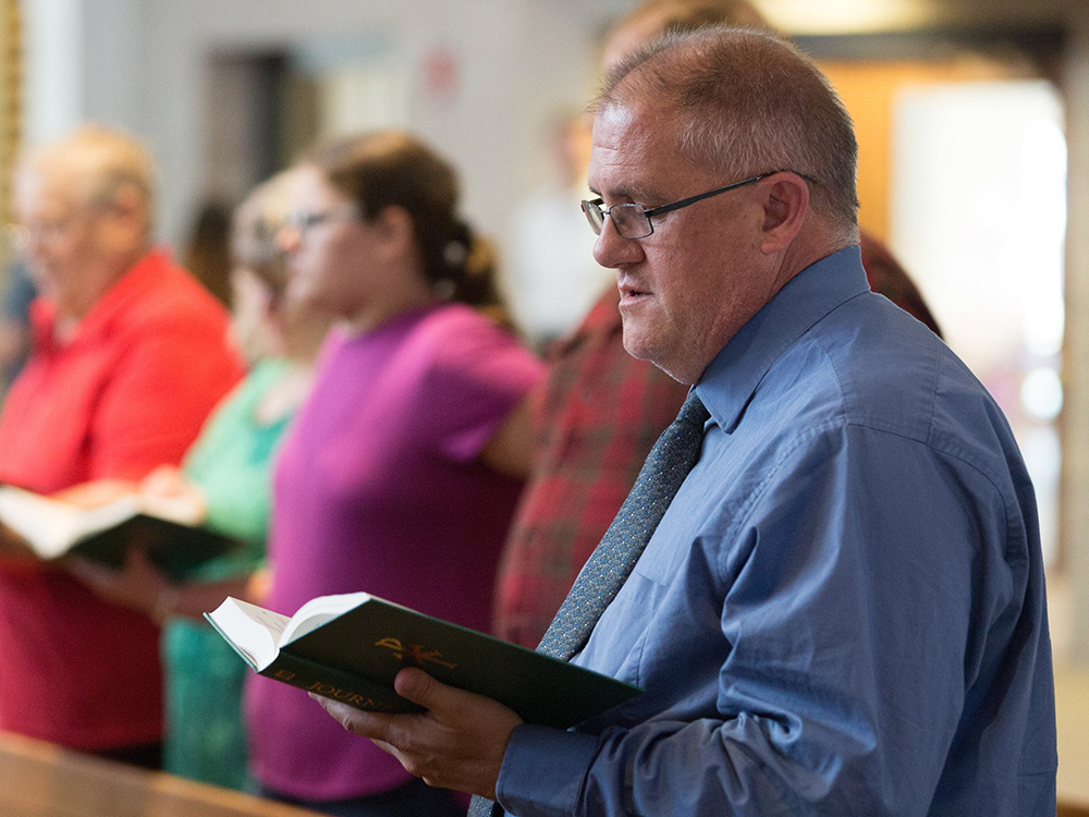 Daniel Markham prays during Mass at St. Michael Catholic Church in St. Michael, Minnesota, June 13, 2021, during his "52 Masses" tour. (CNS/The Catholic Spirit/Dave Hrbacek)