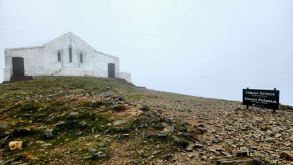 A white stucco chapel marks the summit of Croagh Patrick, Ireland's 2,500-foot holy mountain in County Mayo. (Mark Piper)