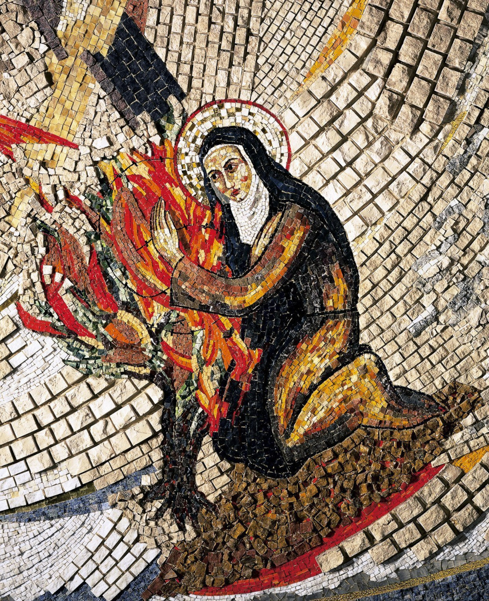 A mosaic featuring a woman wearing a white coif and black veil with arms around flames