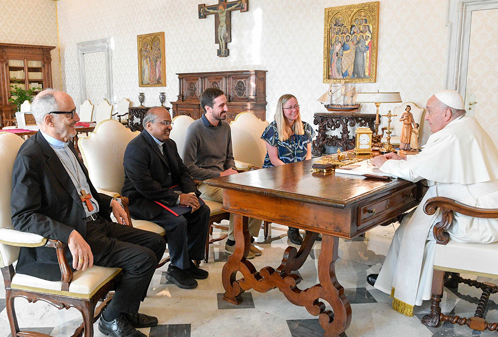 Pope Francis meets with leaders of the Laudato Si' Movement in the library of the Apostolic Palace at the Vatican Nov. 6. From left to right: Cardinal Michael Czerny, prefect of the Dicastery for Promoting Integral Human Development, Jesuit Fr. Xavier Jeyaraj, Tomas Insua and Lorna Gold. (CNS/Vatican Media)