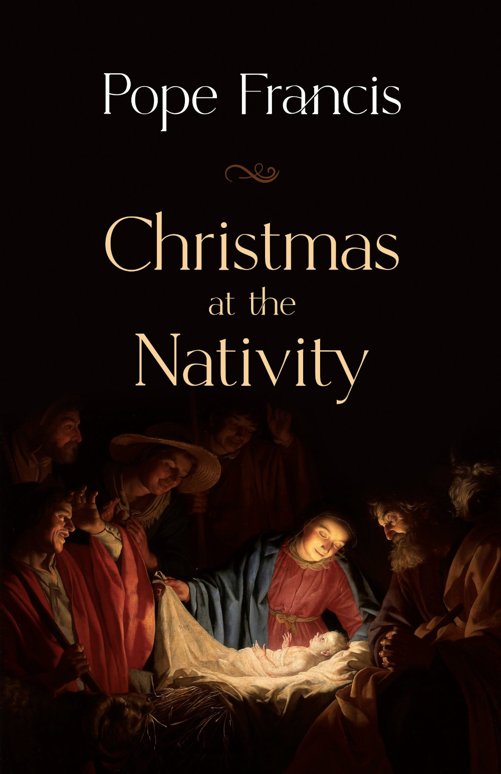 A book cover with a nativity scene says "Pope Francis: Christmas at the Nativity"