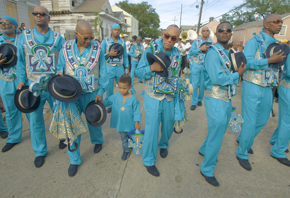 The group Black Men of Labor is seen marching and singing "Amazing Grace" during their annual second line parade in the documentary "City of a Million Dreams." (Courtesy of Spirit Tide Productions)