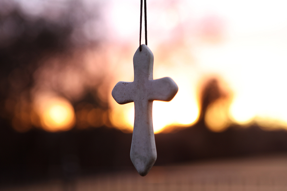 A cross hangs from a tree outside a Catholic home in Aledo, Texas, Dec. 29, 2019. (CNS/Bob Roller)