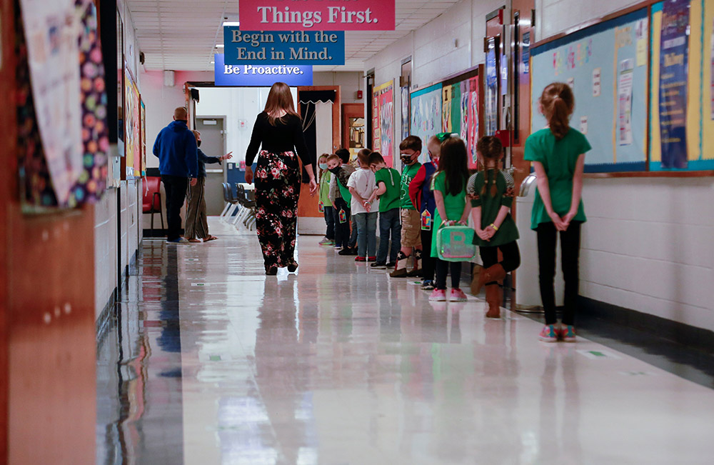 Students in Louisville, Kentucky, practice social distancing on the first day back to school March 17, 2021, after COVID-19 restrictions were adjusted. (CNS/Reuters/Amira Karaoud)