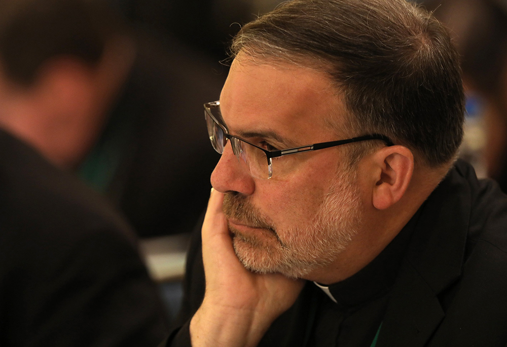 Bishop John Stowe of Lexington, Kentucky, listens to a speaker during the fall general assembly of the U.S. Conference of Catholic Bishops Nov. 12, 2019, in Baltimore. (CNS/Bob Roller)