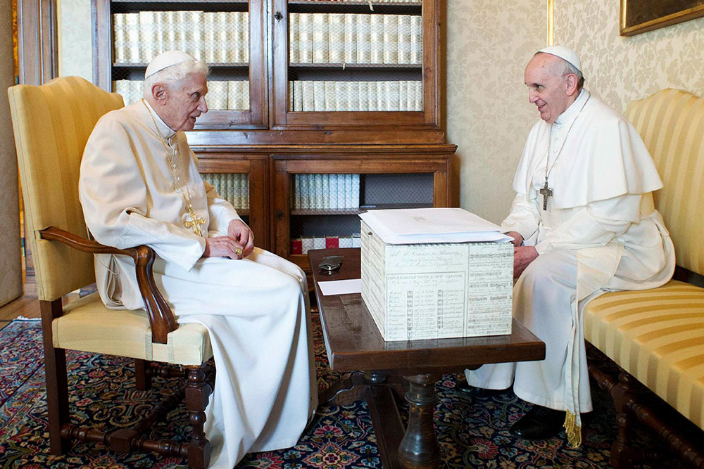 Pope Francis talks with retired Pope Benedict XVI at the papal summer residence at Castel Gandolfo, Italy, March 23, 2013. (OSV News/Vatican Media via Reuters)