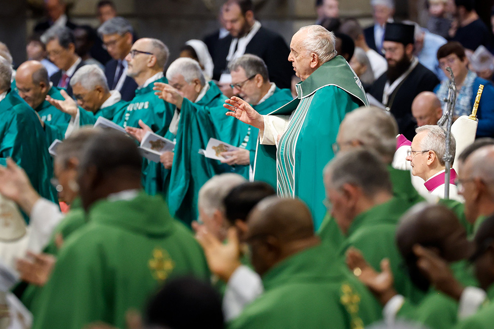 Pope Francis prays during Mass in St. Peter's Basilica at the Vatican Oct. 29, marking the conclusion of the first session of the Synod of Bishops on synodality. (CNS/Lola Gomez)