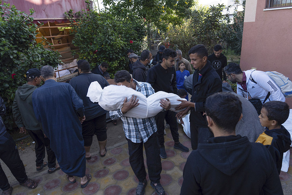 Palestinians mourn their relatives killed in the Israeli bombardment of the Gaza Strip Dec. 3. (AP/Fatima Shbair)