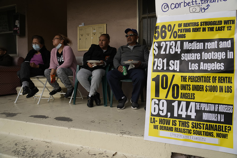 Tenants hold a community rally in the Baldwin Hills neighborhood in Los Angeles Jan. 8, 2023, urging that their buildings, home to 40 families and more than 100 low-income tenants, not be sold to investors. (AP/Damian Dovarganes)
