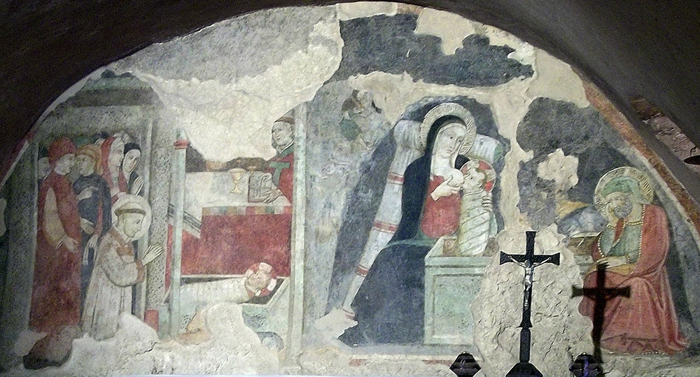 A 15th-century fresco at the Sanctuary of Greccio in Italy depicts St. Francis of Assisi and the Nativity scene of Greccio at left, and the Nativity of Bethlehem at right. (Wikimedia Commons/altotemi)