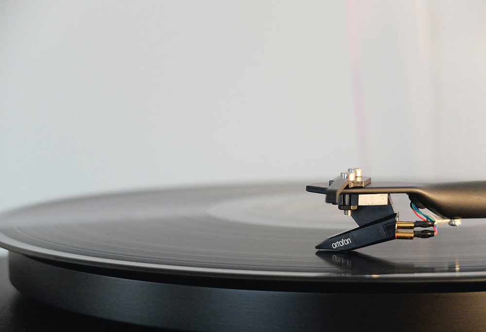 A record player is seen in a closeup photo. (Unsplash/Adrian Korte)