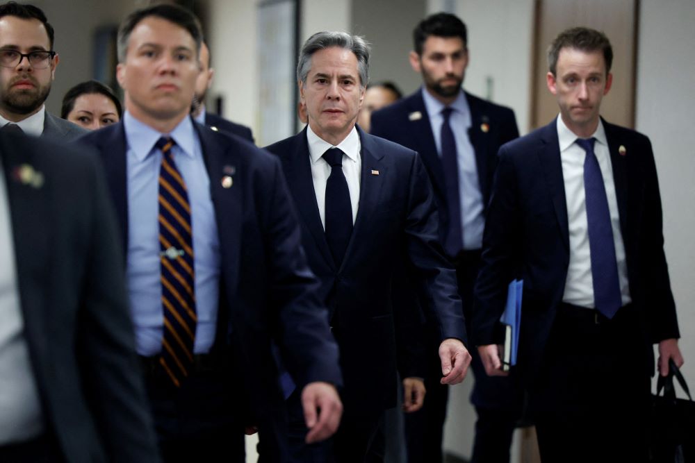 U.S. Secretary of State Antony Blinken, center, is seen Jan. 9 in Tel Aviv, Israel, during a weeklong trip aimed at calming tensions across the Middle East. (OSV News/Reuters/Evelyn Hockstein)