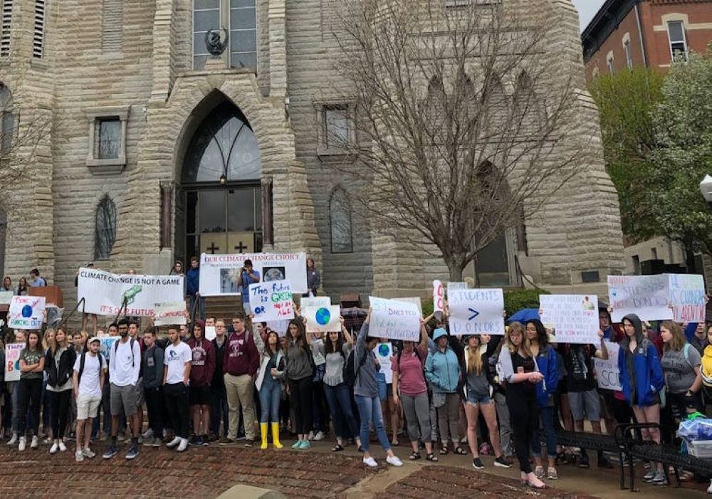 Hundreds of Creighton University students demonstrate in April 2020. pressing the Jesuit school to take increased action on climate change, including divesting its endowment from fossil fuels. In January 2021, the university announced it would phase out all investments in fossil fuels.