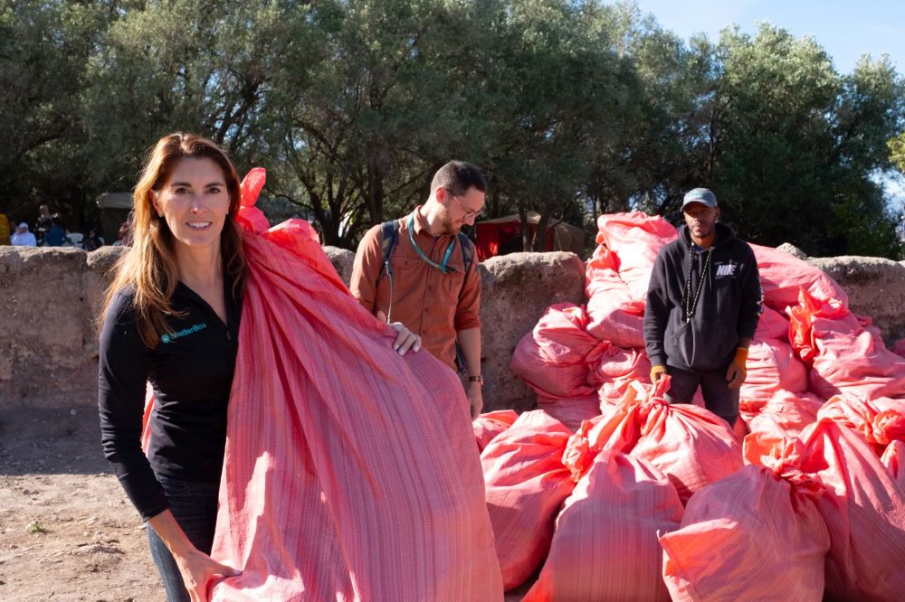 Kerri Murray, president of ShelterBox USA, delivers bags with blankets to people in Ukraine in February 2023.
