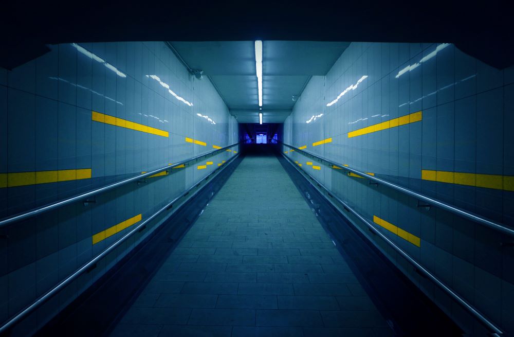 Hallway with computer screens lining walls