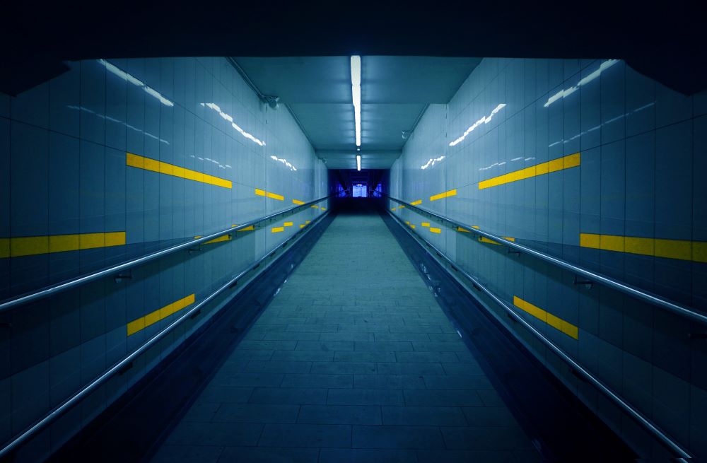 Hallway with computer screens lining walls 