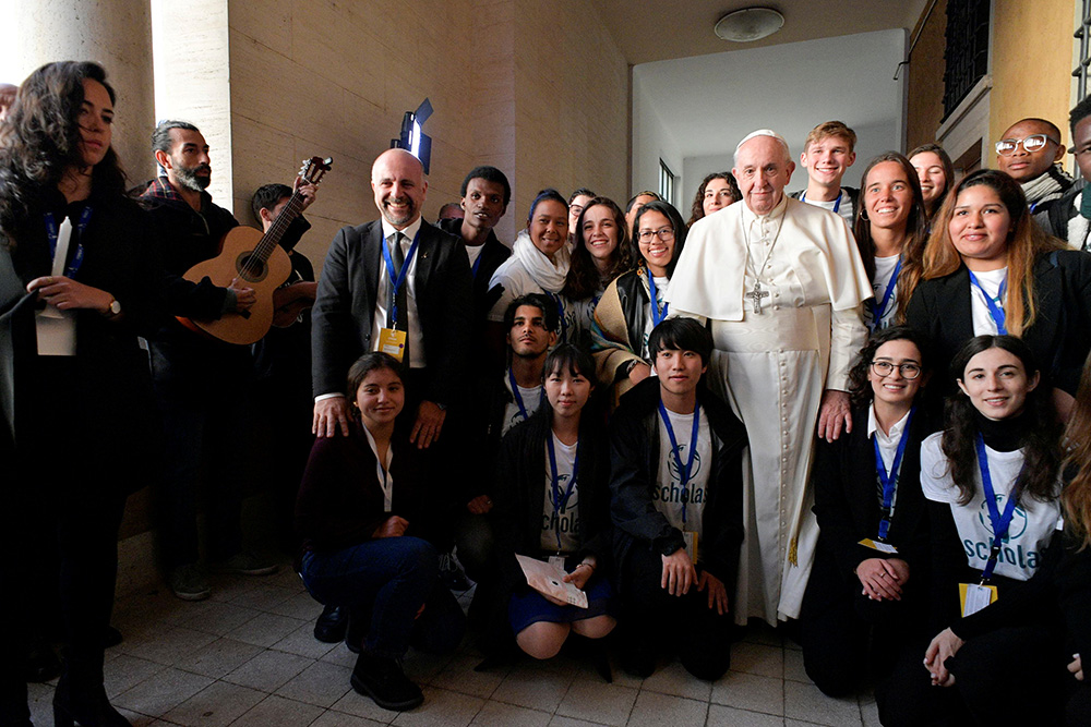 Pope Francis poses after he inaugurated the new headquarters of Scholas Occurrentes, the Vatican's foundation that works to link technology and the arts for social integration and world peace, in Rome Dec. 13, 2019. (CNS/Vatican Media)