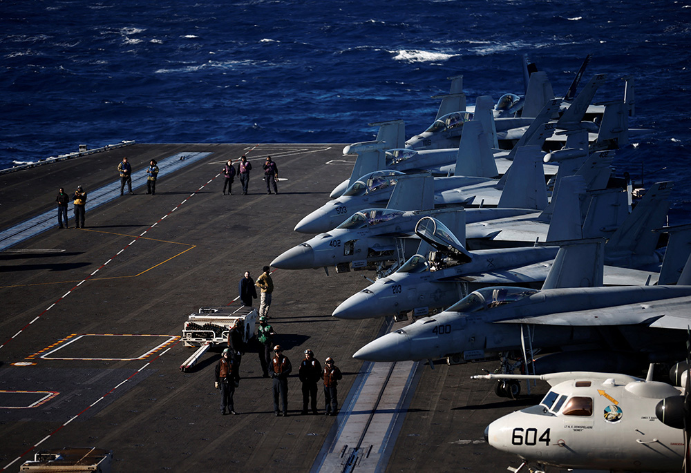 U.S. Navy sailors are seen aboard aircraft carrier USS Harry S. Truman Feb. 2, 2022, in the Adriatic Sea. The Truman strike group is operating under NATO command and control along with several other NATO allies for coordinated maritime maneuvers, anti-submarine warfare training and long-range training. (CNS/Reuters/Yara Nardi)