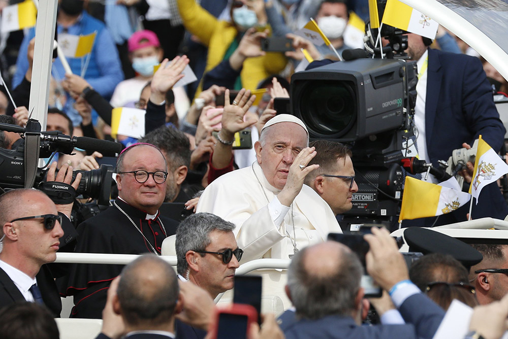 Pope Francis is accompanied by Archbishop Charles Scicluna of Malta as he greets the crowd before celebrating Mass at the Granaries in Floriana, Malta, April 3, 2022. (CNS/Paul Haring)