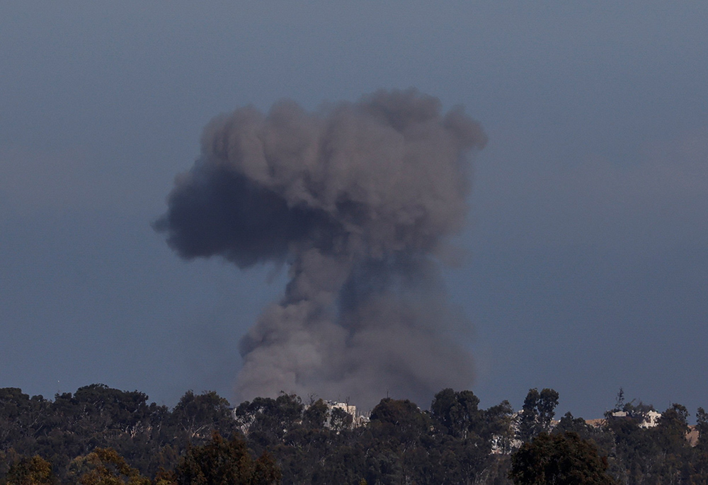 Smoke rises over Gaza during Israeli strikes, as seen from southern Israel Jan. 13, 2024, amid the ongoing conflict between Israel and the Palestinian Islamist group Hamas. (OSV News/Reuters/Tyrone Siu)
