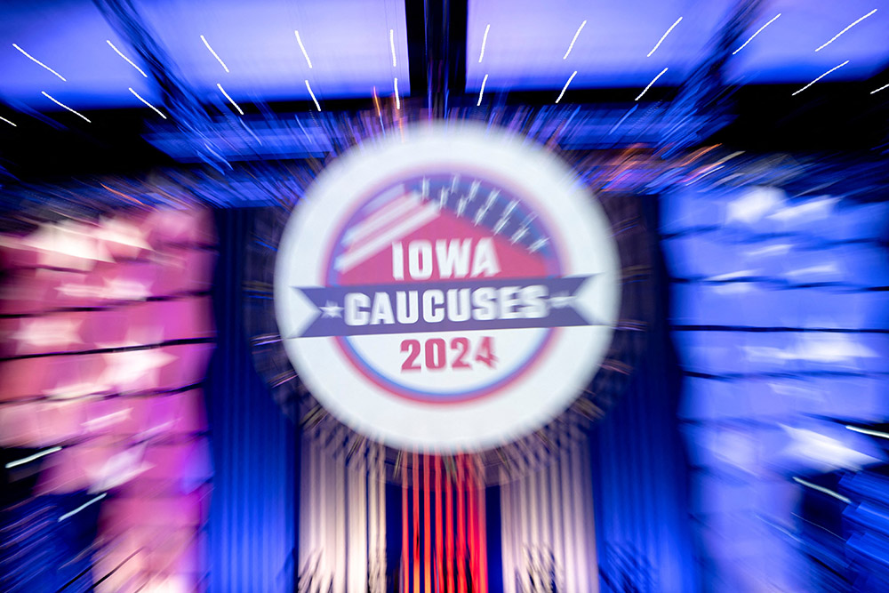 Signage for the 2024 Iowa caucuses is seen taken with a long exposure at the Iowa Caucus Media Center located within the Iowa Events Center in Des Moines Jan. 14. (OSV News/Reuters/Cheney Orr)