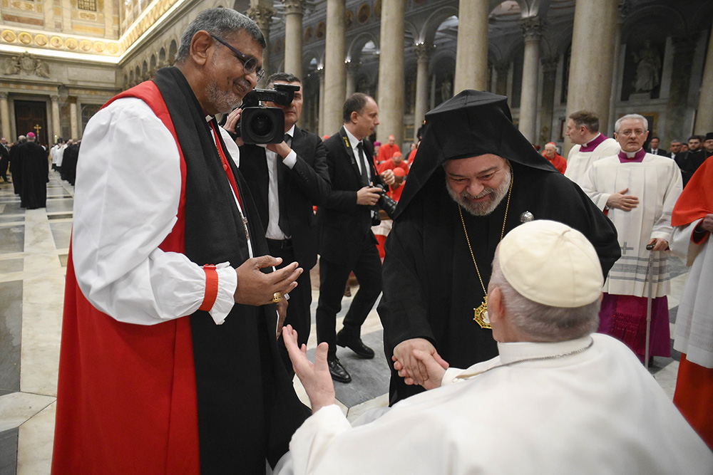 Pope Francis meets Anglican Archbishop Ian Ernest, the archbishop of Canterbury's representative in Rome, and Orthodox Metropolitan Polykarpos of Italy, the Ecumenical Patriarchate's representative in Rome, during an ecumenical evening prayer service marking the end of the Week of Prayer for Christian Unity at the Basilica of St. Paul Outside the Walls in Rome Jan. 25. (CNS/Vatican Media)