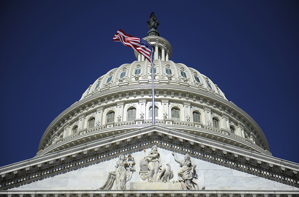 A file photo shows the American flag below the U.S. Capitol dome in Washington. A traditional Latin Mass was held at the capitol Jan. 23, 2024. (OSV News/Reuters/Jonathan Ernst)