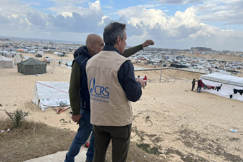 Sean Callahan, president of Caritas North America and CEO of Catholic Relief Services, in a tan vest, is pictured during his visit to southern Gaza Jan. 23, 2024. (OSV News/Courtesy Catholic Relief Services)