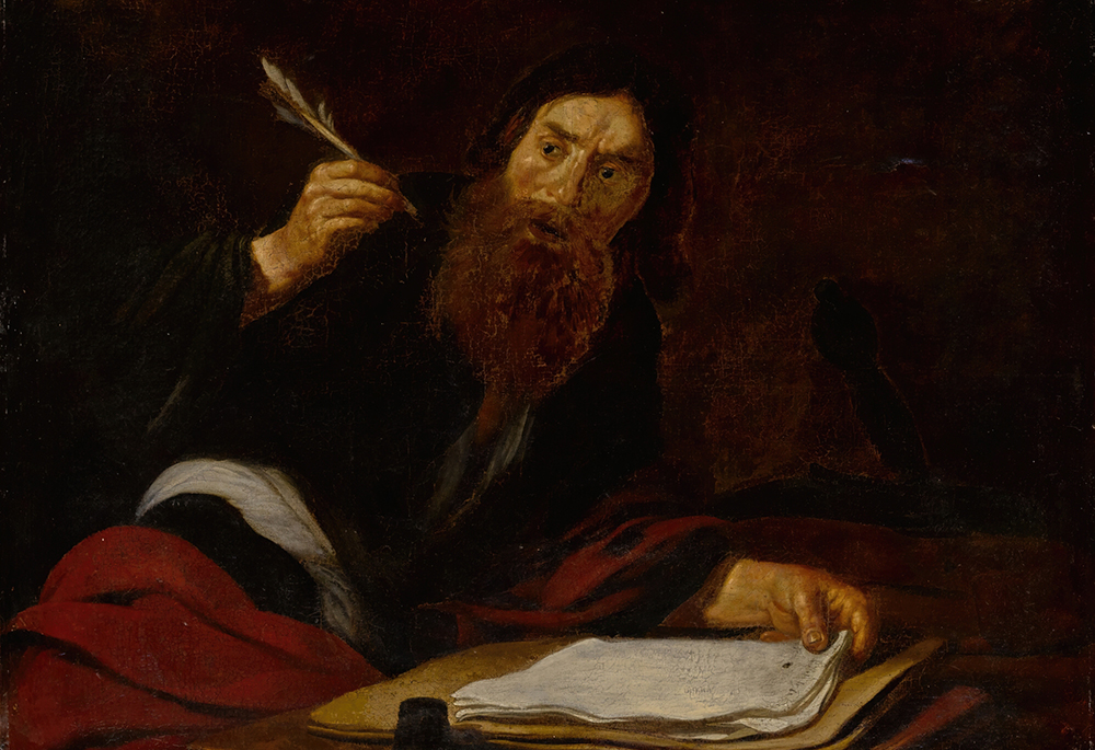 "St. Paul writing at his desk" by French artist Claude Vignon (Artvee)