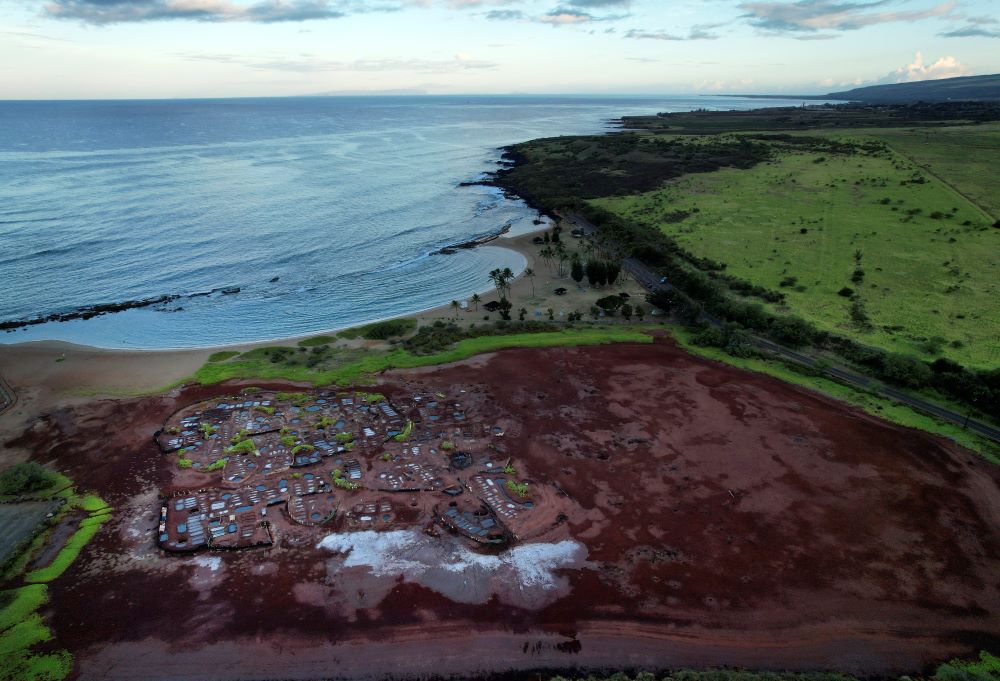 An arial view of the Hanapepe salt patch near Salt Pond Beach Park on Tuesday, July 11, 2023, in Hanapepe, Hawaii. The existence of this salt patch is being threatened by climate change, rising sea levels and pollution. (AP Photo/Jessie Wardarski)