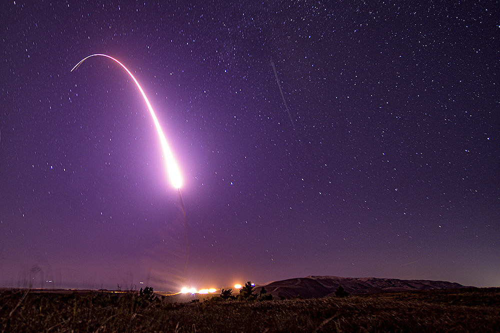 This image taken with a slow shutter speed on Oct. 2, 2019, and provided by the U.S. Air Force shows an unarmed Minuteman 3 intercontinental ballistic missile test launch at Vandenberg Air Force Base, California. (U.S. Air Force via AP/Staff Sgt. J.T. Armstrong)