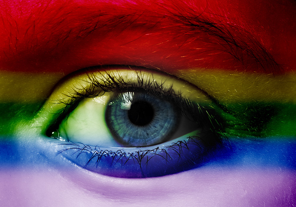 Human eye with an overlay of rainbow colors (Dreamstime/Verastuchelova)