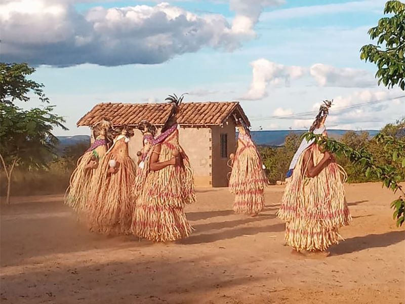 Members of the Pankararu Indigenous people perform the toré ritual, with the “enchanted” wearing the croá-made praiás, or sacred garments, in the state of Minas Gerais, Brazil. (Photo by Eduardo Campos Lima)