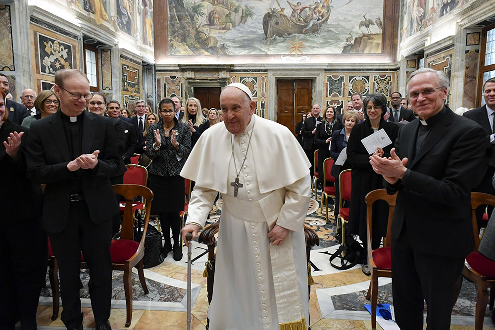 Pope Francis with an audience from the University of Notre Dame on Feb. 1. At right is Holy Cross Fr. John Jenkins and at left is Holy Cross Fr. Robert Dowd, who will succeed Jenkins as president of the university in July. (Courtesy of University of Notre Dame/Vatican Media)