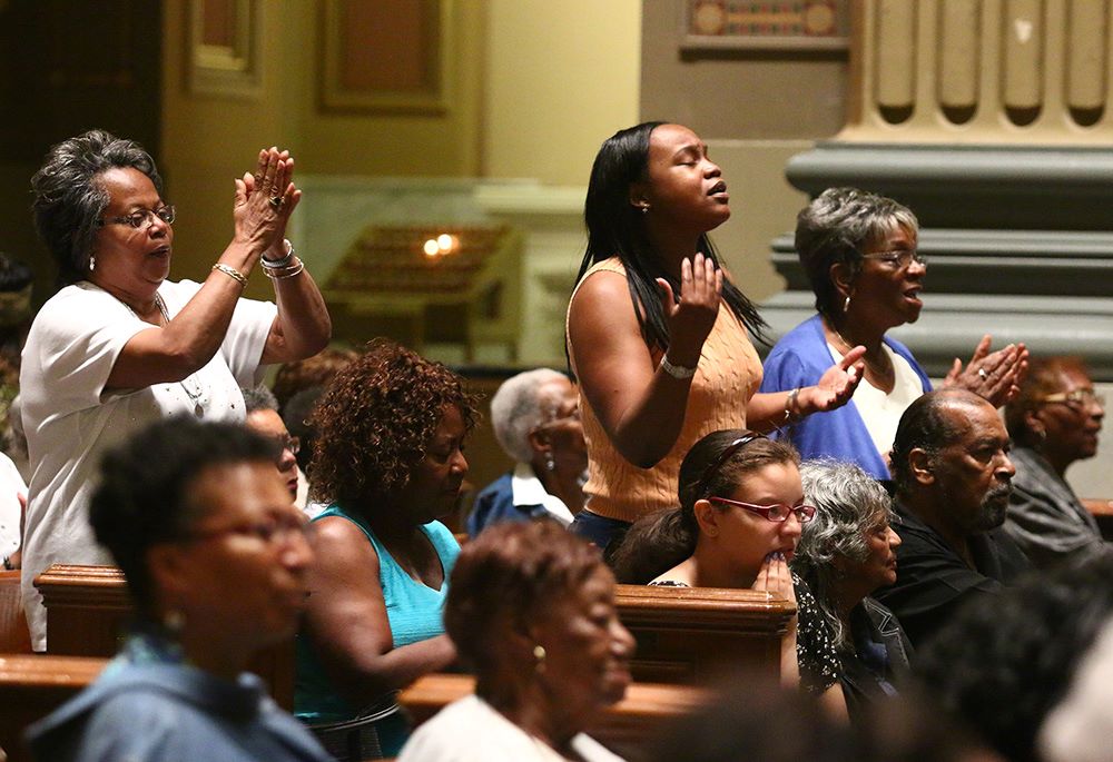 Black Catholics participate in a revival in the Cathedral Basilica of Sts. Peter and Paul in Philadelphia.
