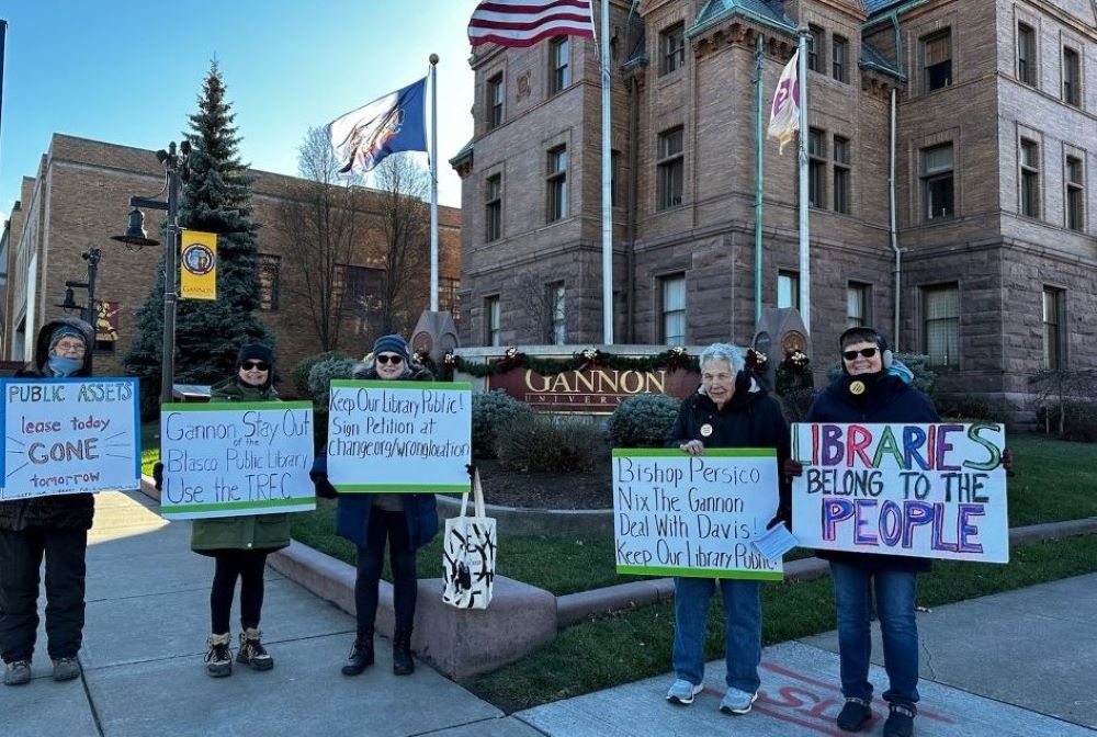 Keep Our Library Public members protest outside Gannon University in Erie, Pa., on Dec. 13.