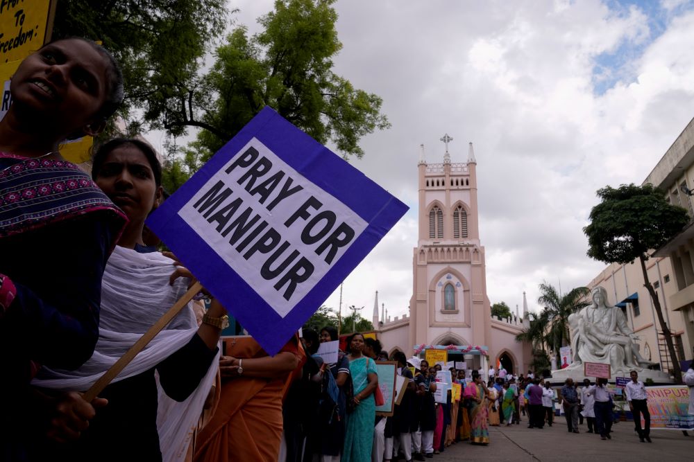 Catholics hold placards and participate in a peace rally against violence in the northeastern Manipur state, in Hyderabad, India, on Aug. 25.