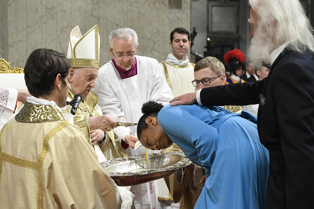 Pope Francis baptizes Auriea Harvey, a woman from the United States, during the Easter Vigil Mass in St. Peter's Basilica at the Vatican in this file photo from April 8, 2023. (CNS/Vatican Media)