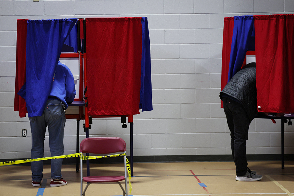 Voters cast their ballots at the Webster School in Manchester, N.H., shortly after polls opened in the New Hampshire presidential primary election Jan. 23, 2024. (OSV News/Reuters/Mike Segar)