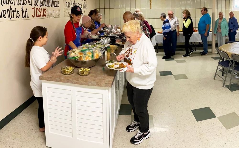In this undated photo, parishioners from Our Lady of Lourdes and St. Jude in Columbiana, Ohio, provide a community meal to those living in the East Palestine area, the scene of a toxic train derailment in February 2023 that continues to impact the wider area. (OSV News photo/courtesy Father Chad Johnson)